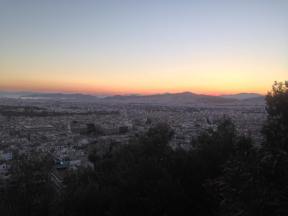 The sun sets over Athens